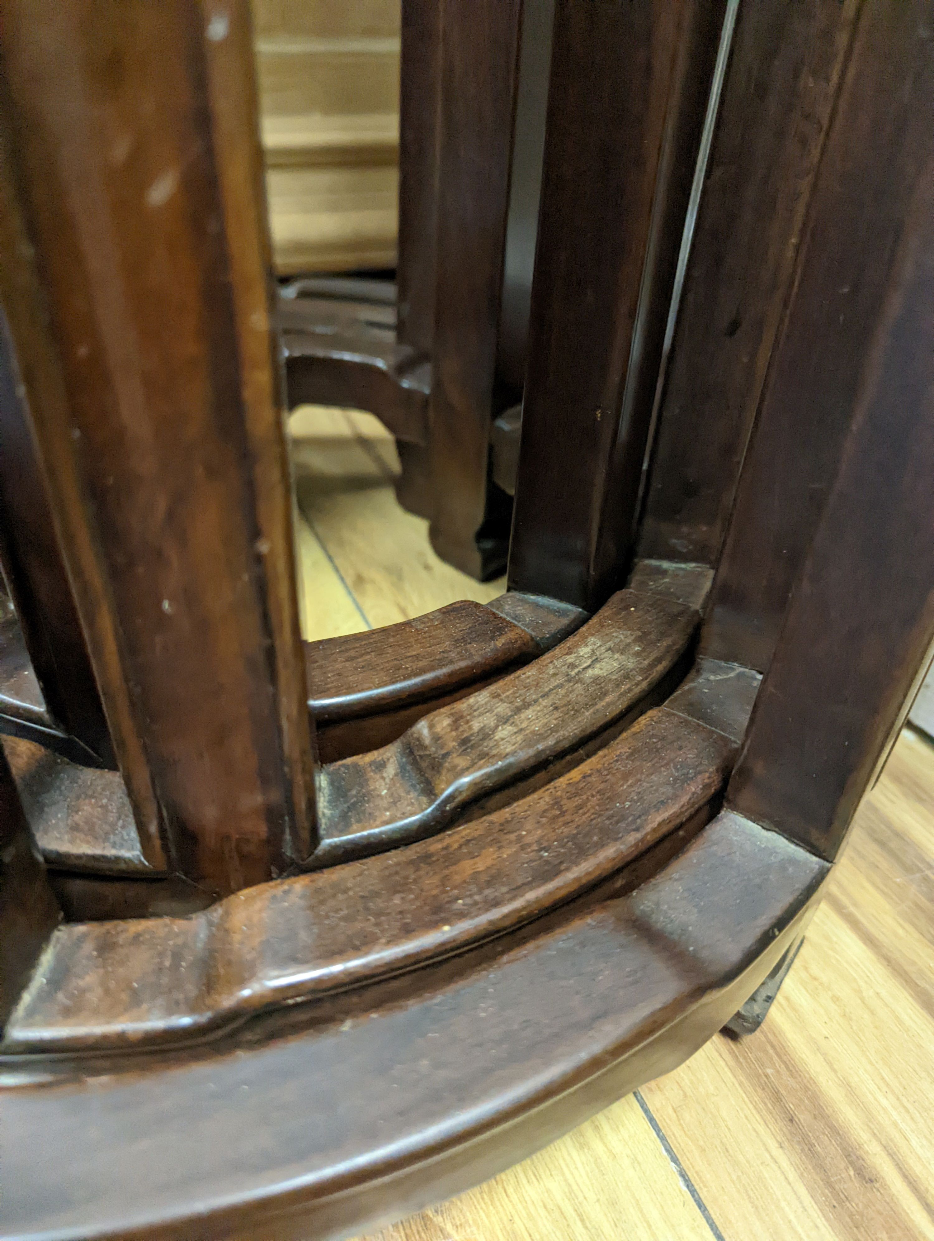 A nest of four Chinese hardwood circular tables, largest diameter 40cm, height 67cm